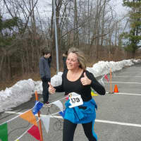 <p>Brookfield resident Pam Mannion completes her very first race on Friday.</p>