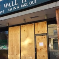 <p>Great Wall II Chinese Restaurant on East Boston Post Road in Mamaroneck remained boarded up on Tuesday after a fire destroyed its interior on Monday morning, closing down Route 1 through the village.</p>