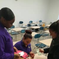 <p>Garfield High School students sells capes for a fundraiser.</p>