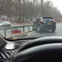 <p>This SUV slid into the median on the southbound Taconic State Parkway in Putnam on Friday.</p>