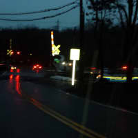 <p>Commerce Street&#x27;s railroad crossing in Valhalla -- facing toward the Taconic State Parkway -- as it looked on Wednesday evening, the first anniversary of Metro-North&#x27;s deadliest train accident.</p>