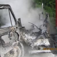 <p>The cab of the tractor-trailer was completely destroyed in the fire, but the driver escaped unharmed.</p>