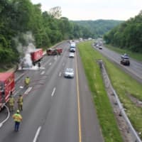 <p>Firefighters are able to keep one lane of I-84 open as they battle the fire in Newtown.</p>