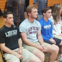 <p>From left, Eric Greenberg, Jason Bienstock and Chris Conley wear their respective college shirts during a ceremony recognizing Mamaroneck High seniors&#x27; who aim to compete in college. All three Tigers have committed to college lacrosse teams.</p>