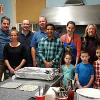<p>Members of Fairfield Chamber of Commerce&#x27;s FELO gather in the kitchen as they prepare food for clients of Operation Hope.</p>