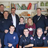 <p>The Ridgewood Fire Department with HealthBarn USA founder Stacey Antine.</p>