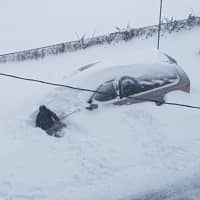 <p>Someone tries to dig out their car in Poughkeepsie</p>