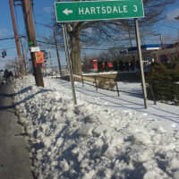 <p>Snow-covered sidewalks overflow onto Route 119 in Greenburgh near Knollwood Road.</p>