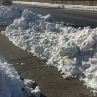 <p>A closeup of sidewalks along Route 119 in Greenburgh on Thursday. Ice-coated snow have caked many walkways and spilled onto roadways around town.</p>