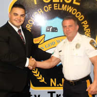 <p>New Officer Nick Dimovski with Elmwood Park Police Chief Michael Foligno.</p>