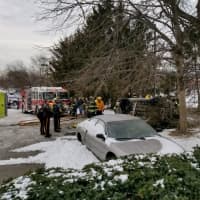 <p>First responders work to free the victim from his vehicle Monday morning in Paramus.</p>