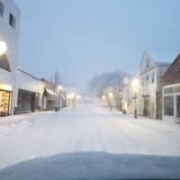 <p>Westport&#x27;s snowy Main Street looking quiet and serene Wednesday evening before trees started falling and power went out.</p>