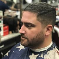 <p>Wycokff Officer Bill Christopher gets ready to have his November beard shaven off at Iconic Barbershop in Glen Rock.</p>