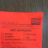 <p>The learning center received this violation and was ordered to remove backpacks from the front yard.</p>