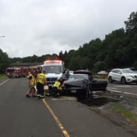 <p>Nichols Fire Department crews respond to a two-car crash on the northbound Merritt in Trumbull on Saturday.</p>