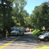 <p>Weston Volunteer firefighters and Weston EMS respond to the car vs. motorcycle crash on Cartbridge Road on Sunday.</p>