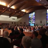 <p>St. Jerome in Norwalk is packed Monday night with people who are supporting Jung Courville, who is facing deportation to her native Korea.</p>