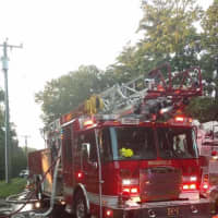 <p>Brookfield Volunteer Fire Company Engine 1 on the scene of a house fire Wednesday evening on Candlewood Lake Road.</p>