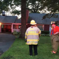 <p>Brookfield Fire Chief Wayne Gravius and his aide Peter Myers at the scene of the house fire in Brookfield.</p>