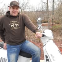 <p>Chris Rago on one of the Doggy Deuce scooters.</p>