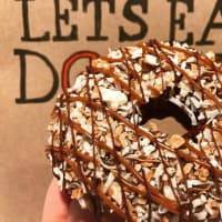 <p>The &quot;Samora&quot; is a cake doughnut half-dipped in milk chocolate, topped with dulce de leche and toasted coconut, and drizzled with more dulce de leche and chocolate.</p>