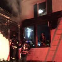 <p>Fairfield firefighters battle the blaze in the historic home on the Old Post Road.</p>