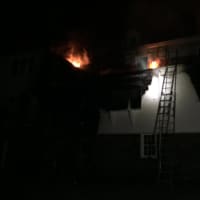 <p>The fire is visible on the second floor windows of the home at 480 Old Post Road in Fairfield.</p>