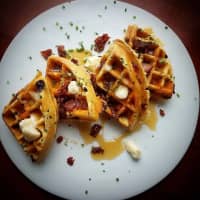 <p>Aesop&#x27;s Fable Restaurant in Chappaqua just added brunch to its menu. Pictured is a bacon, cheddar and chive waffle with Vermont maple syrup.</p>