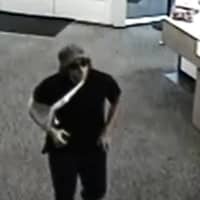 <p>Monroe police released this surveillance photo of the suspect in the armed robbery of a People&#x27;s Bank branch last month.</p>