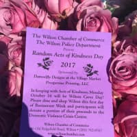 <p>The pink roses from police officers came with a purple note promoting Wilton Restaurant Week and a fundraiser for the Domestic Violence Crisis Center.</p>