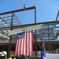 <p>The final beam is lifted into place Monday as construction continues on the new headquarters for the Stamford Police Department.</p>