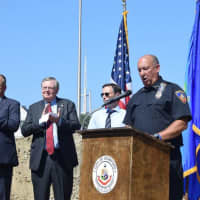 <p>Police Chief Jon Fontneau speaks at the topping-off ceremony for the new police headquarters in downtown Stamford with Mayor David Martin, and Director of Public Safety Ted Jankowski.</p>