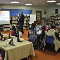<p>Students at Morris Street School learn a lesson in fine dining.</p>