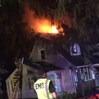 <p>Firefighters from several departments battled the three-alarm blaze, which broke out just before 2:30 a.m. on Sunrise Drive.</p>