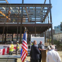 <p>Mayor David Martin, Police Chief Jon Fontneau and Director of Public Safety Ted Jankowski at the topping-off ceremony for the new police headquarters in downtown Stamford.</p>