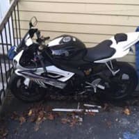 <p>Stamford officers found the motorcycle behind a home and hidden under a tarp, police said.</p>