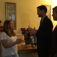 <p>U.S. Rep. Jim Himes and his wife, Mary, visit Miriam Martinez Lemus on Wednesday in her Stamford home.</p>