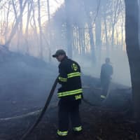<p>The Georgetown Volunteer Fire Department responds to a fire on Redding Road in Redding sparked by a downed power line.</p>