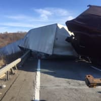 <p>A tractor-trailer lost control and crashed on I-84.</p>
