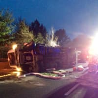 <p>A tractor-trailer carrying 5,000 live chickens rolled over on eastbound I-84 near Exit 13 in Southbury on Saturday morning.</p>
