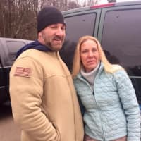 <p>Jeff Kehlenbach, left, found the missing K9 Texas near a pond in Ridgefield. Laura Stabell of Ridgefield gave him a ride to the rescue staging area</p>