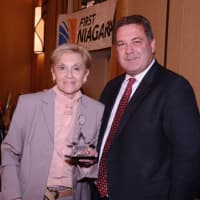 <p>ArtsWestchester CEO Janet Langsam, left, with Hon. Mayor Mike Spano, right, who accepted the Community Award for the City of Yonkers.</p>