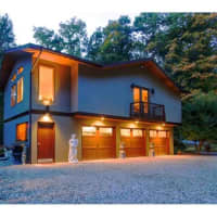 <p>The home at 25 Ketcham Road includes a 3-car garage with a top-level that could be used as a home gym, office space or even a yoga or recording studio. </p>
