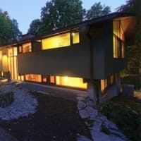 <p>The home at 25 Ketcham Road in Ridgefield glimmers in the night.</p>
