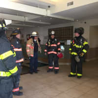 <p>Danbury firefighters respond to a minor fire in the elevator shaft at the La Quinta Inn &amp; Suites hotel on Newtown Road on Monday afternoon.</p>