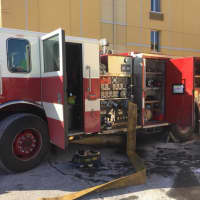 <p>Danbury firefighters respond to a minor fire in the elevator shaft at the La Quinta Inn &amp; Suites hotel on Newtown Road on Monday afternoon.</p>