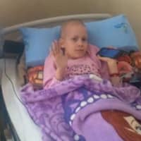 <p>Bile, 9, is undergoing chemotherapy for a cancerous brain tumor.</p>