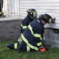 <p>Firefighters and building inspectors were assessing damage.</p>
