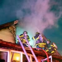 <p>Firefighters battle Agar Place blaze in South Hackensack.</p>