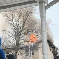 <p>Flames blew through the roof, collapsing part of it.</p>